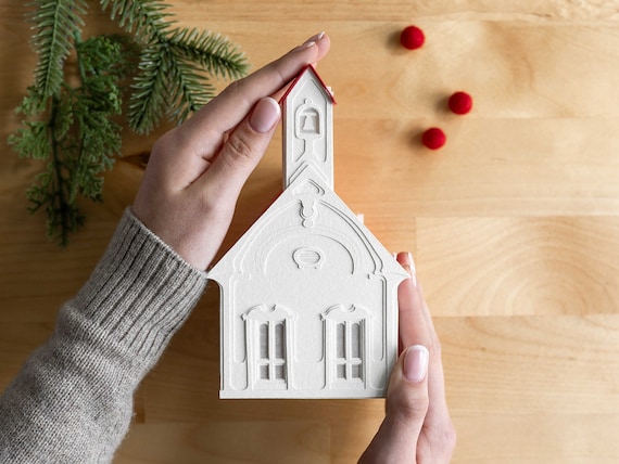 Schoolhouse Christmas Village Luminary - handmade of fine papers. Folds completely flat between seasons.