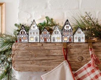 Half-Timbered Christmas Village: handmade layered-paper luminaries, folds flat to store