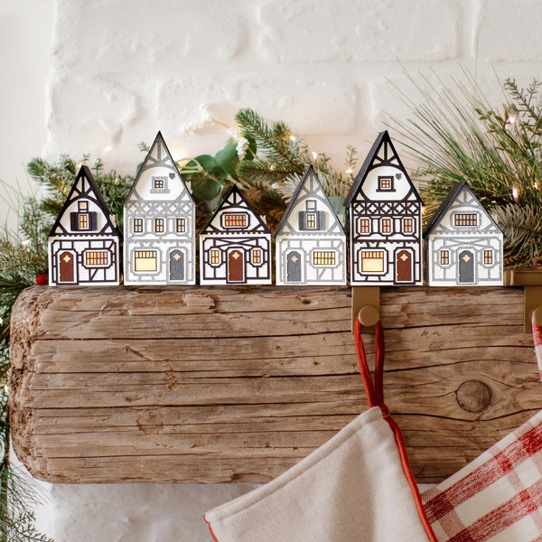 Half-Timbered Christmas Village: handmade layered-paper luminaries, folds flat to store