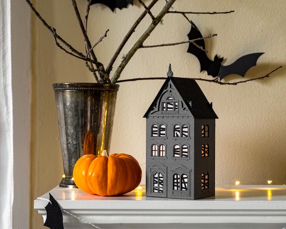 Haunted house paper luminary for Halloween: a spooky & sustainable Victorian beauty that folds flat to store