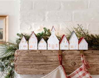 Lighted Christmas Village: holiday decorations handcrafted of layered paper, folds flat to store