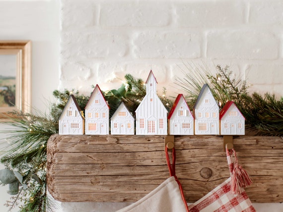 Lighted Christmas Village: holiday decorations handcrafted of layered paper, folds flat to store