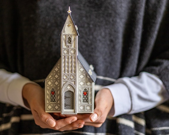Christmas village church luminary: handcrafted of intricate layers of heavyweight watercolor paper, and it folds nearly flat for storage