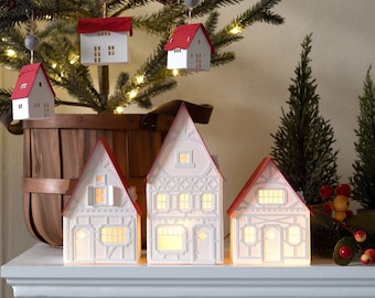 Handmade Christmas Village: white mantel decor of layered paper, folds completely flat to store