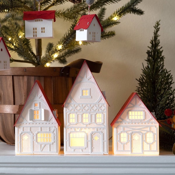 Handmade Christmas Village: white mantel decor of layered paper, folds completely flat to store