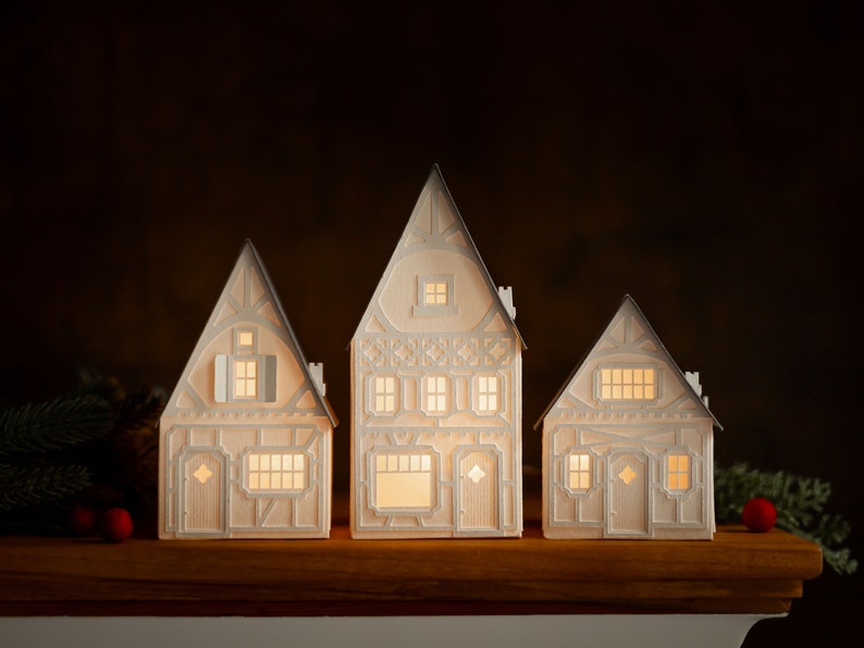 Lighted Christmas Village: holiday decorations handcrafted of layered paper, folds flat to store Gray timber