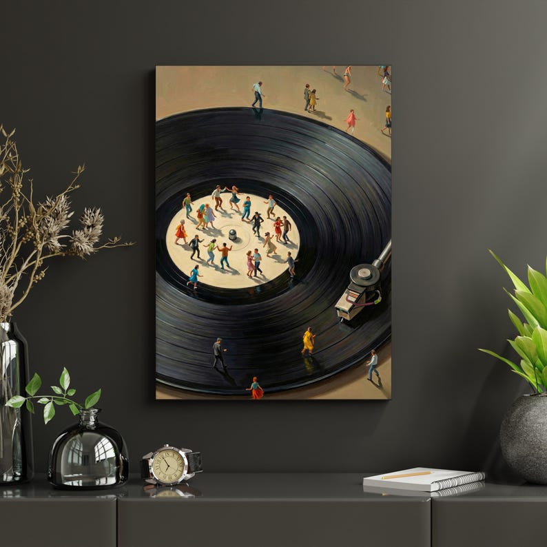 May include: A framed artwork depicts a black vinyl record with miniature figures dancing on its surface. The record player's needle is in place, and the figures are dressed in various colors. The background is a neutral beige.