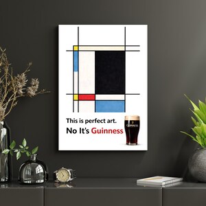 May include: A framed print featuring a Mondrian-style abstract design with black lines and blocks of color. The text reads, "This is perfect art. No It's Guinness," with a pint of Guinness stout.