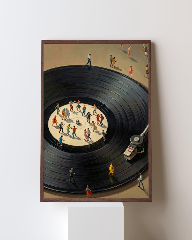 May include: A framed art print depicts a black vinyl record with miniature figures dancing and walking on its surface. The artwork features a brown frame and a white background, creating a surreal and whimsical scene.