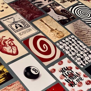 May include: A collection of various art prints with a vintage aesthetic. The prints feature diverse imagery, including a guitar, a human heart, a black eight ball, and the text "You Just Wanna Be Me."
