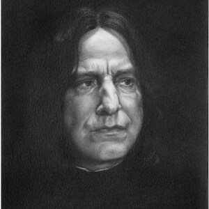 May include: A black and white charcoal drawing of a person with long dark hair, a prominent nose, and a serious expression. The portrait features high-contrast shading, highlighting the facial structure against a dark, solid black background.