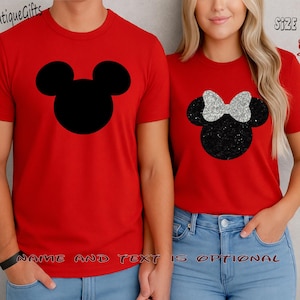 May include: Red t-shirts with black Mickey Mouse and Minnie Mouse designs. The Mickey Mouse design is a solid black silhouette, while the Minnie Mouse design features a glittery black head and a silver bow. The text "NAME AND TEXT IS OPTIONAL" is visible.
