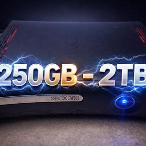 May include: Black Xbox 360 console with the text "250GB - 2TB" in silver and gold, highlighted with blue lightning effects. The console has a power button with a blue light.