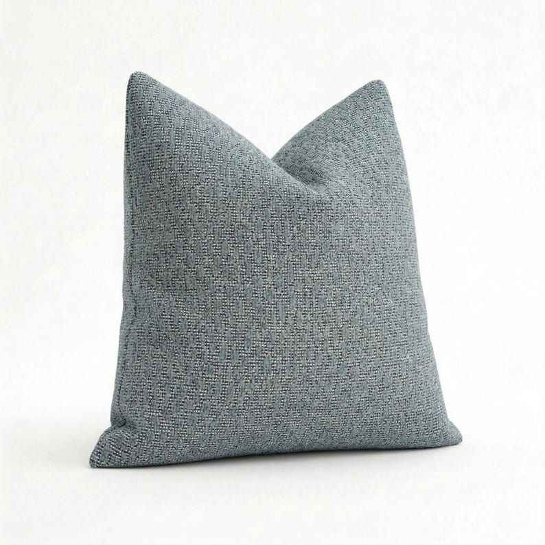 May include: A white ceramic mug with a black handle and the text "But First, Coffee" in a black, bold font. The mug is on a white surface. The mug is approximately 4 inches tall.