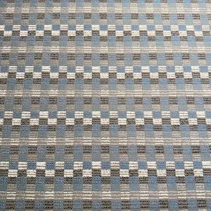 May include: Close-up of a woven fabric with a repeating pattern of squares and horizontal stripes. The colour palette includes shades of blue, grey, white, and black. The texture appears to be slightly raised, creating a visual depth. This textile could be used for upholstery or home decor.