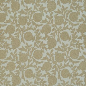 May include: A repeating pattern of tan pomegranates and leaves on a light beige background. The design is a stylized, botanical print, suitable for fabric or wallpaper. The pomegranates are round with a textured appearance.