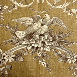 May include: A vintage-style illustration featuring two doves perched on a floral branch. The design is in shades of brown and white, with detailed floral and ornamental elements. The background has a textured, golden-brown appearance.