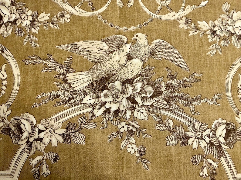 May include: A vintage-style illustration featuring two doves perched on a floral branch. The design is in shades of brown and white, with detailed floral and ornamental elements. The background has a textured, golden-brown appearance.