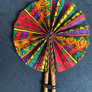 Handmade in Ghana out of pure leather and African print fabric these fans are a beauty to behold.