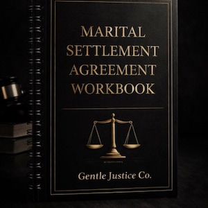 May include: A black spiral-bound workbook with the title "Marital Settlement Agreement Workbook" in gold lettering and a gold scale illustration. The book is from Gentle Justice Co. on a dark background.