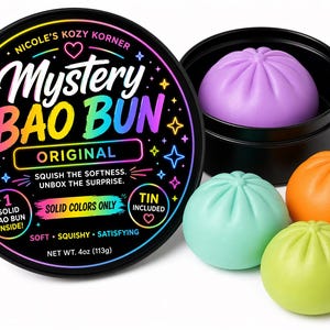 May include: A black tin with a colorful label reading "Mystery Bao Bun Original" next to four colorful, squishy bao buns. The buns are in shades of purple, green, orange, and teal. The tin includes one bao bun inside.