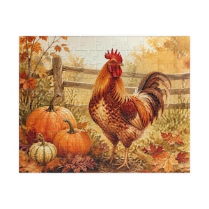 May include: A jigsaw puzzle featuring a vibrant rooster standing in a field with three orange and green pumpkins. The scene includes a wooden fence in the background and scattered autumn leaves in shades of red, orange, and yellow on the ground.