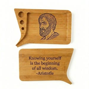 May include: A two-piece bamboo tray set. The top tray features a carved image of Aristotle and three circular cutouts. The bottom tray has the quote "Knowing yourself is the beginning of all wisdom. -Aristotle."