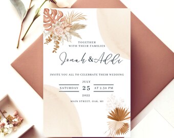May include: A wedding invitation with a beige background and brown floral illustrations. The text reads "Together with their families Jonah & Addi Invite you all to celebrate their wedding Saturday July 25 at 2:30 PM 2022 Main Street, Oak, MI"