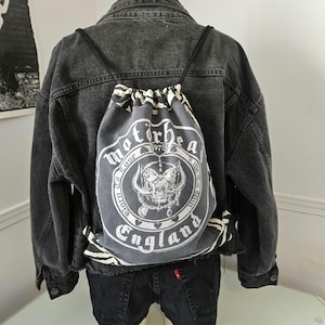 Handmade drawstring backpack made from a Motörhead t-shirt and recycled black jeans
