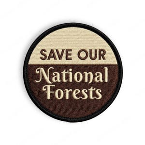 May include: Circular embroidered patch with the text "SAVE OUR National Forests". The patch is divided into two sections: a tan upper half and a brown lower half. The text is in a serif font.