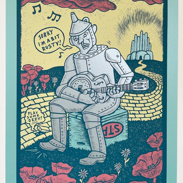 A BIT RUSTY a silkscreen print handmade by Dan Blakeslee depicting the Tinman from Oz playing a resonator guitar on the yellow brick road