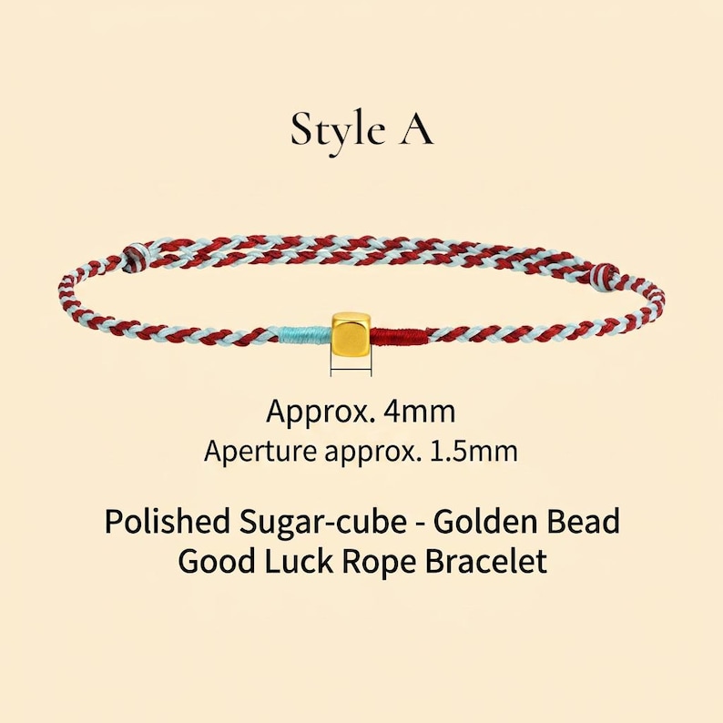 Puede incluir: Una pulsera de cuerda trenzada con hilos rojos, blancos y azules, con una cuenta c&uacute;bica dorada. La pulsera est&aacute; etiquetada como "Style A" y mide aproximadamente 4 mm. El texto dice "Polished Sugar-cube - Golden Bead Good Luck Rope Bracelet."