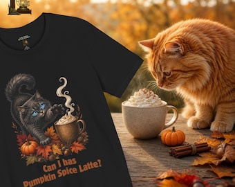 May include: A black t-shirt featuring a graphic of a black cat with blue eyes reaching towards a steaming mug of pumpkin spice latte surrounded by autumn leaves and a small pumpkin, with the text Can I has Pumpkin Spice Latte?