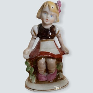 Vintage Ceramic Girl on bench figurine