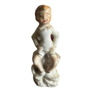 Vintage Boy on a tree trunk Figurine, Japan
