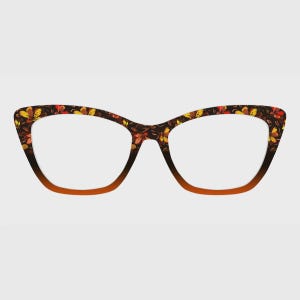 May include: Cat-eye glasses featuring a dark brown frame with a vibrant floral pattern in shades of yellow, orange, and red. The upper portion of the rims displays the detailed flower print, while the lower rims transition into a solid brown.