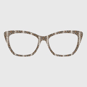 May include: Cat-eye style eyeglasses with a snakeskin pattern in shades of brown, tan, and cream. The frames have a textured appearance, and the lenses are clear. The glasses are set against a plain background.