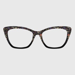 May include: Cat-eye glasses featuring a dark black frame with a printed pattern of gold crescent moons, small red mushrooms, various wildflowers, and delicate butterflies scattered across the entire surface of the front rims.