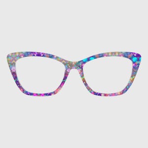 Puede incluir: Gafas de ojo de gato con un patrón multicolor vibrante en tonos morado, azul, rosa y dorado. La montura presenta un diseño denso y moteado con motivos circulares en todo el contorno, creando una apariencia colorida y texturizada.