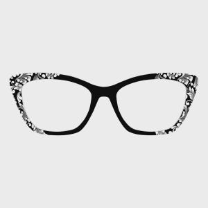 May include: Black cat-eye eyeglasses with a decorative floral pattern in white and gray on the outer edges of the frames. The glasses have a classic, elegant design.