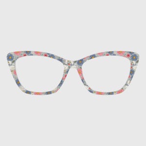 May include: Cat-eye eyeglasses with a floral pattern in pink, blue, and white on a gray background. The glasses have a classic shape with a slightly upswept outer edge.