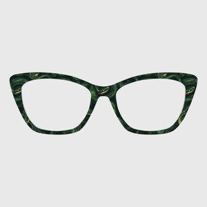 May include: Cat-eye spectacles with a dark green and gold marbled pattern. The frames have a unique design with a slightly pointed upper edge. The lenses are clear, and the overall aesthetic is stylish and modern.
