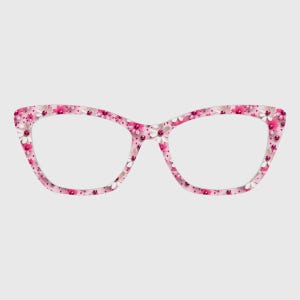 May include: Pink cat-eye eyeglasses with a floral pattern. The frames are covered in small white, pink, and red flowers. The lenses are clear, and the glasses are set against a light gray background.