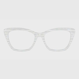 May include: Cat-eye spectacles featuring a translucent white frame with a subtle horizontal striped pattern. The eyewear has a distinct upswept shape at the outer corners and clear lenses, showcasing a clean and simple design for the face.