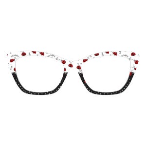 May include: White cat-eye eyeglasses with a ladybug pattern. The frames feature red ladybug illustrations and the words "little ladybug" on a white background. The lower portion of the frames is black with white polka dots.