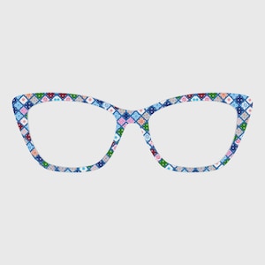 May include: Cat-eye style eyeglasses with a colorful geometric pattern. The frames feature a repeating design of small squares in shades of blue, green, pink, red, and white. The glasses have a classic shape with a slightly upswept outer edge.
