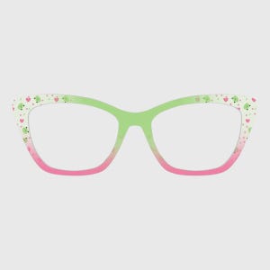 May include: Cat-eye style eyeglasses with a gradient design. The frames transition from pink at the bottom to green at the top. The upper frame is decorated with a pattern of green frog faces and pink hearts. The lenses are clear.