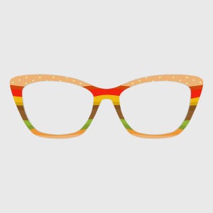 May include: Cat-eye glasses frames featuring a multi-layered design that mimics a hamburger. The top rim is beige with white dots, followed by horizontal stripes of red, yellow, brown, and green, ending with a solid orange bottom rim.