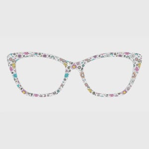 May include: Cat-eye glasses frames featuring a white base color with a repeating pattern of small, colorful hand-drawn style flowers, suns, and rainbows in shades of pink, yellow, blue, and green across the entire surface of the frames.