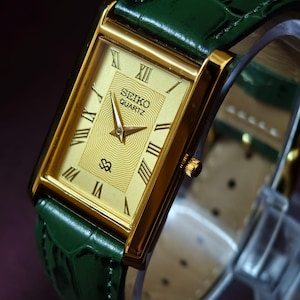 Vintage Seiko Slim Tank Uhr, Gold Zifferblatt, grüne Lederarmband Eleganz Armbanduhr